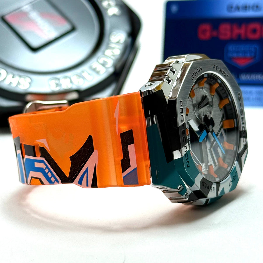 Casio G-SHOCK Skeleton Watch– Multicolor Camo Bezel / Orange Strap