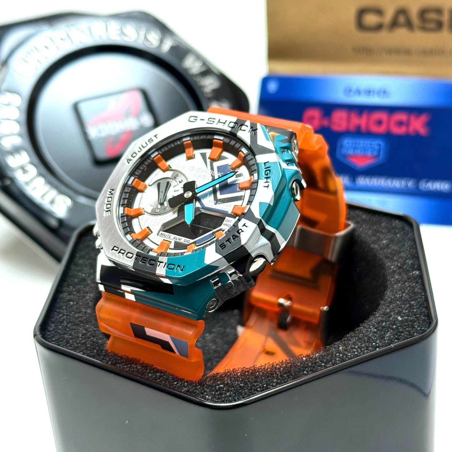 Casio G-SHOCK Skeleton Watch– Multicolor Camo Bezel / Orange Strap