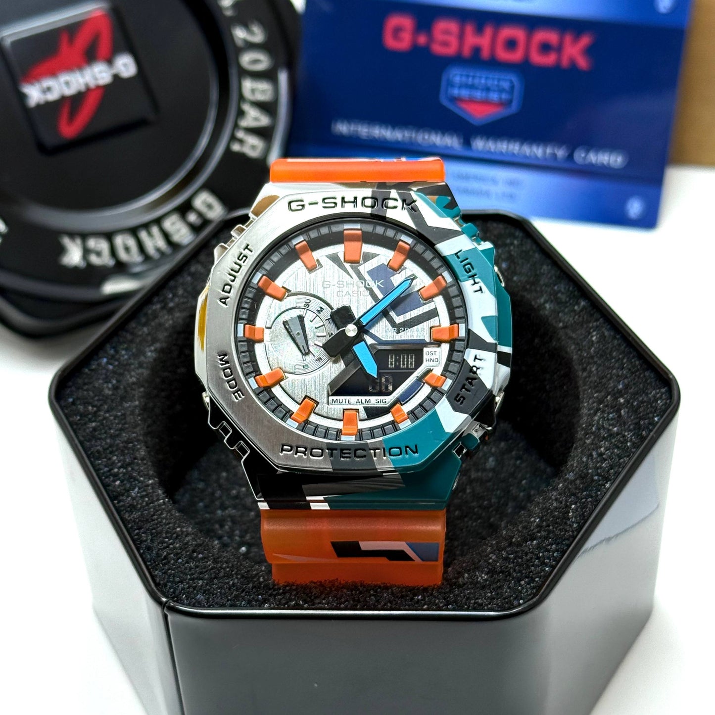 Casio G-SHOCK Skeleton Watch– Multicolor Camo Bezel / Orange Strap