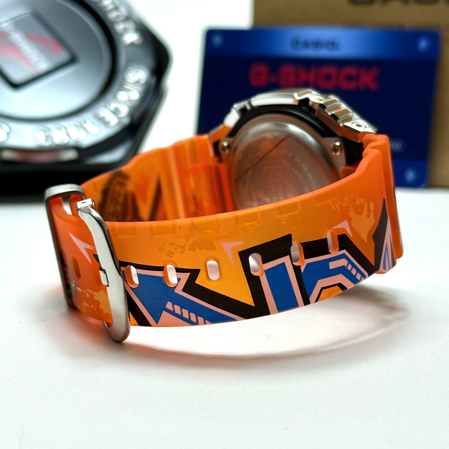Casio G-SHOCK Skeleton Watch– Multicolor Camo Bezel / Orange Strap