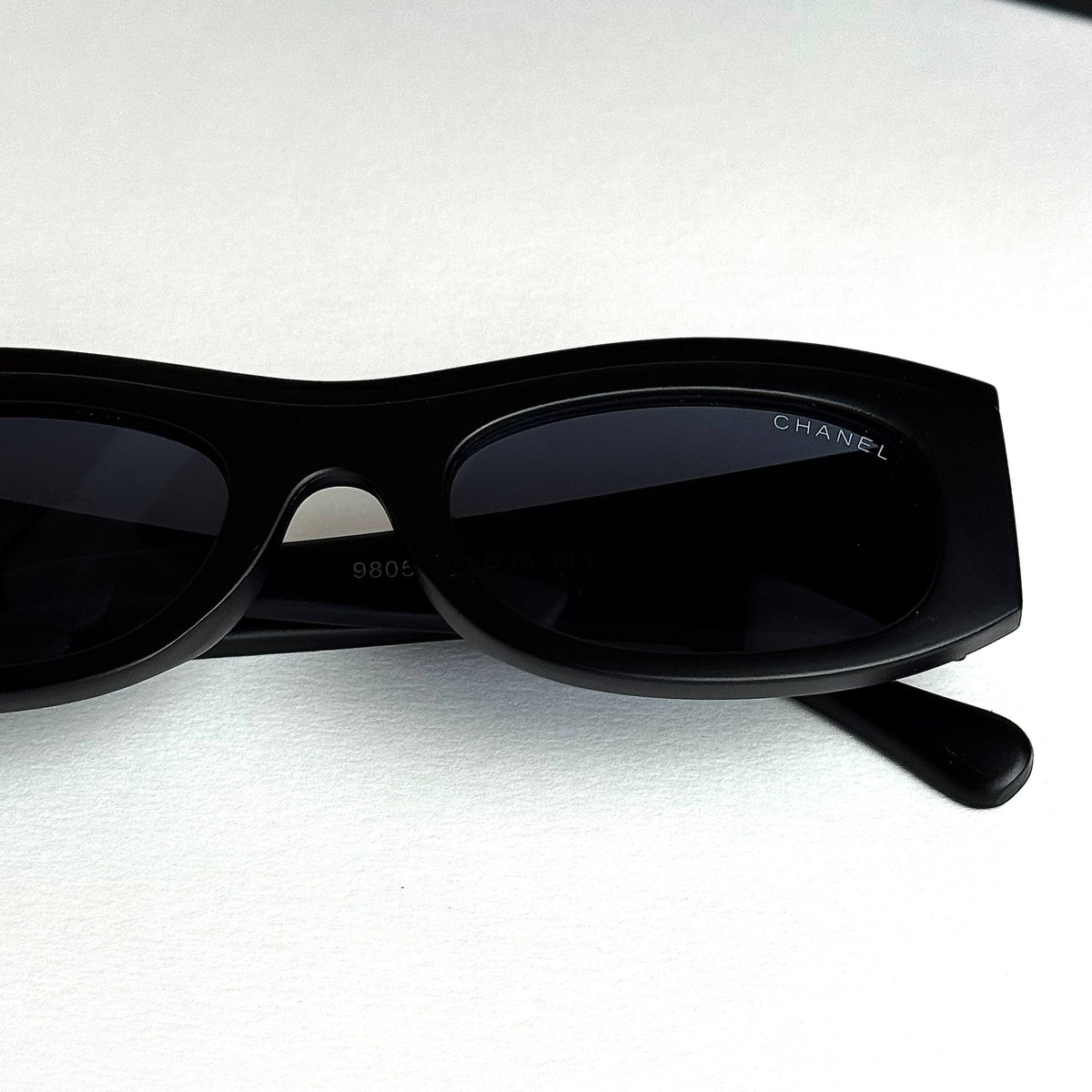 Chanel Signature – Black