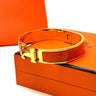 Hermès Clic H — Gold Orange