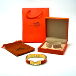 Hermès Clic H — Gold Orange