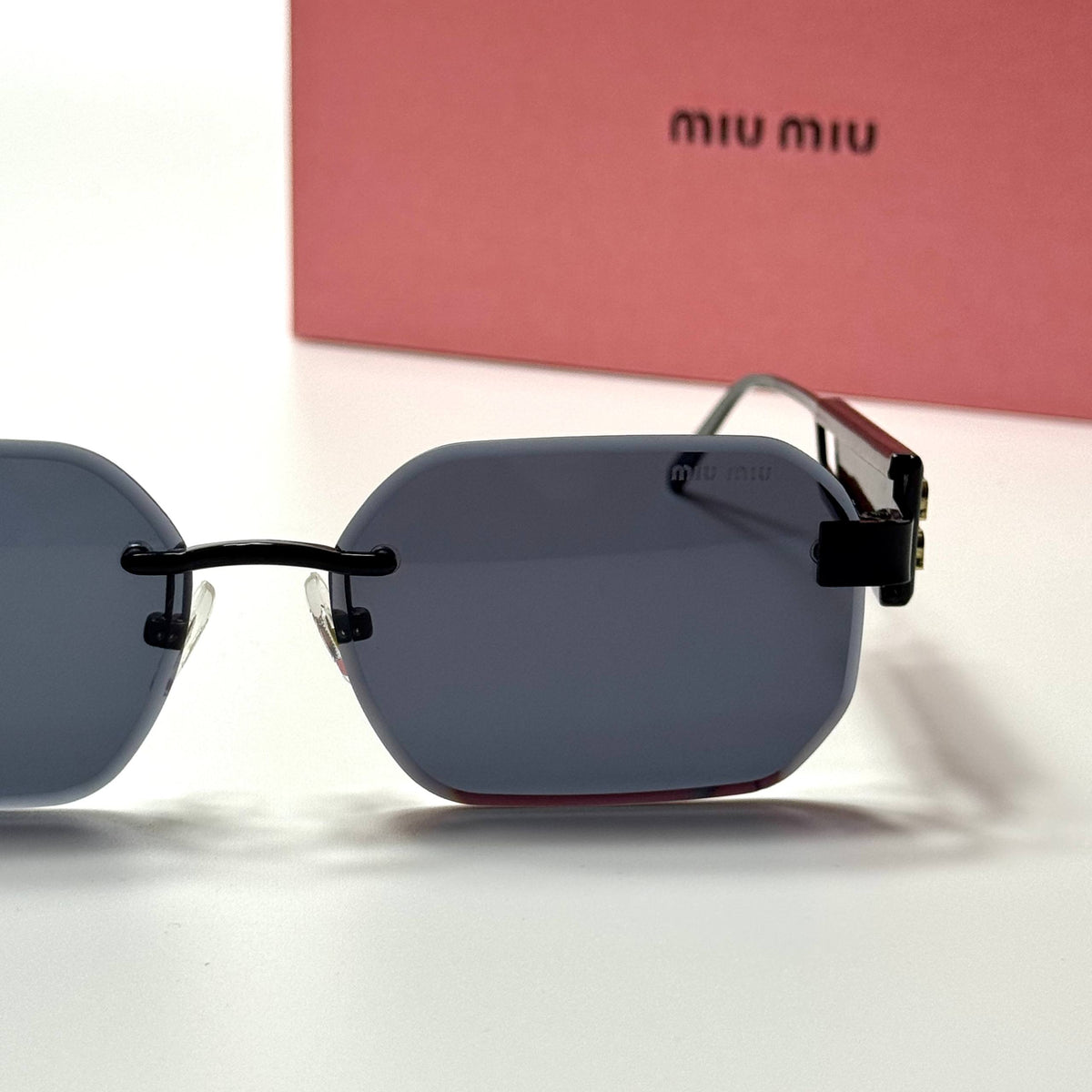 Miu Miu Rectangular Rimless SMU12Z – Black