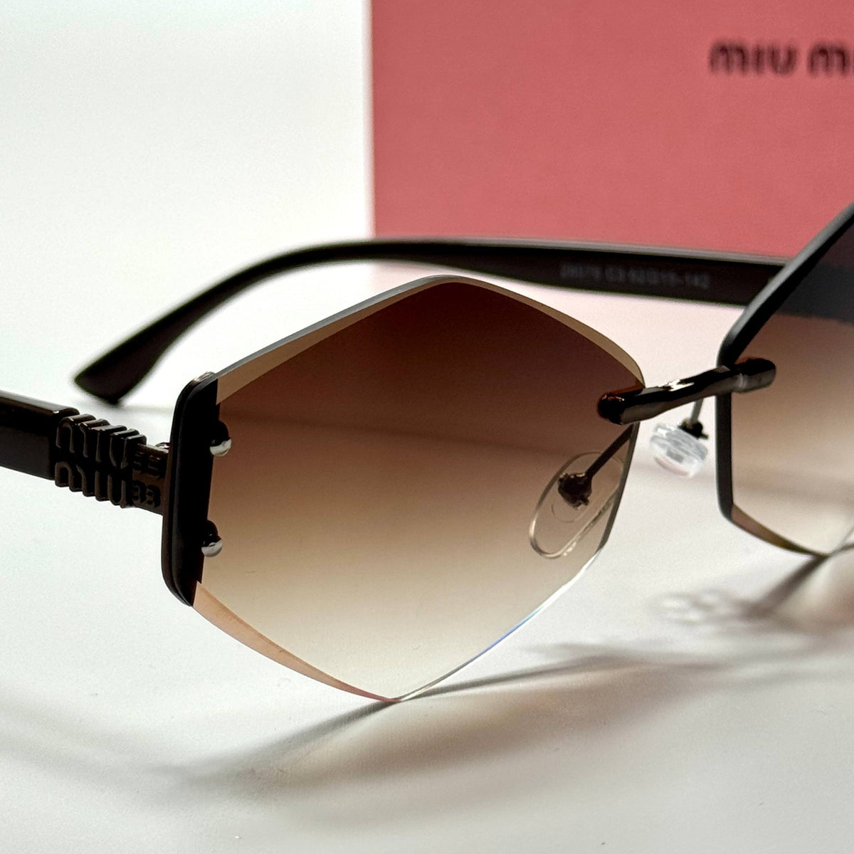 Miu Miu Geometric Rimless SMU18Z – Black Brown Gradient