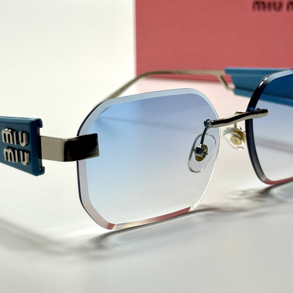 Miu Miu Rectangular Rimless SMU13Z – Blue Silver