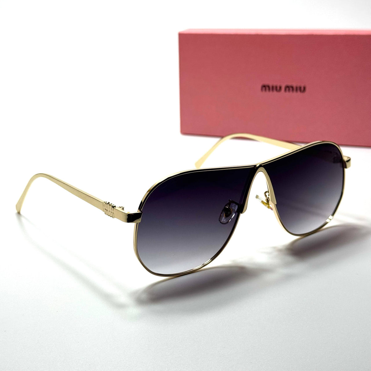 Miu Miu Aviator SMU64Z – Gold Black Gradient