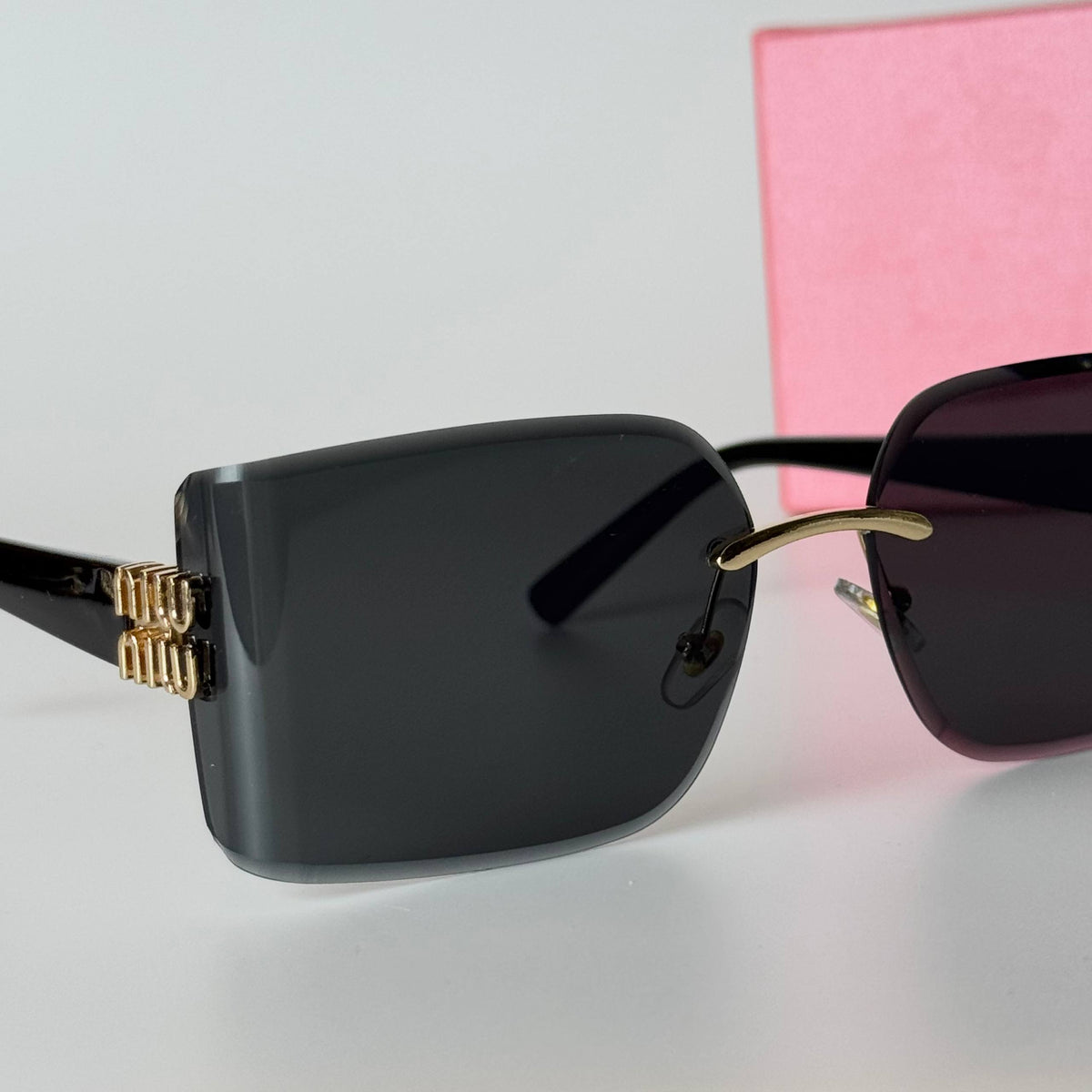 Miu Miu Rimless Rectangle – Black Gold