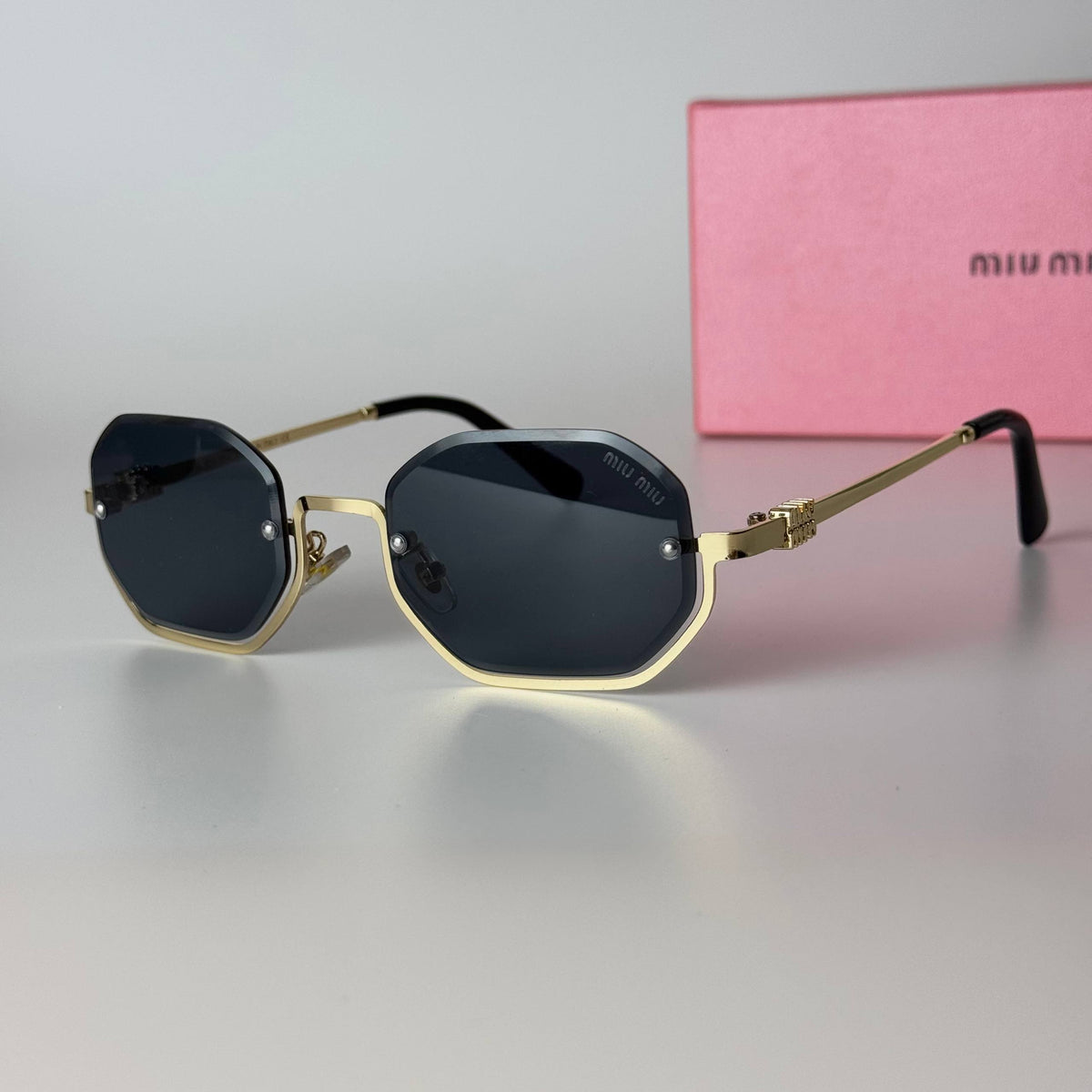 Miu Miu Geometric – Gold Black
