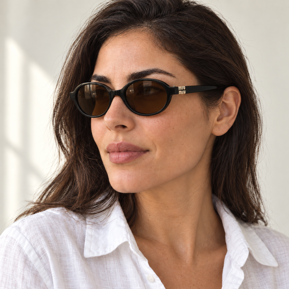 AI-generated styling image: model wearing Miu Miu SMU10Q – Black Brown sunglasses. Fit and scale are illustrative. October 2026 refresh.