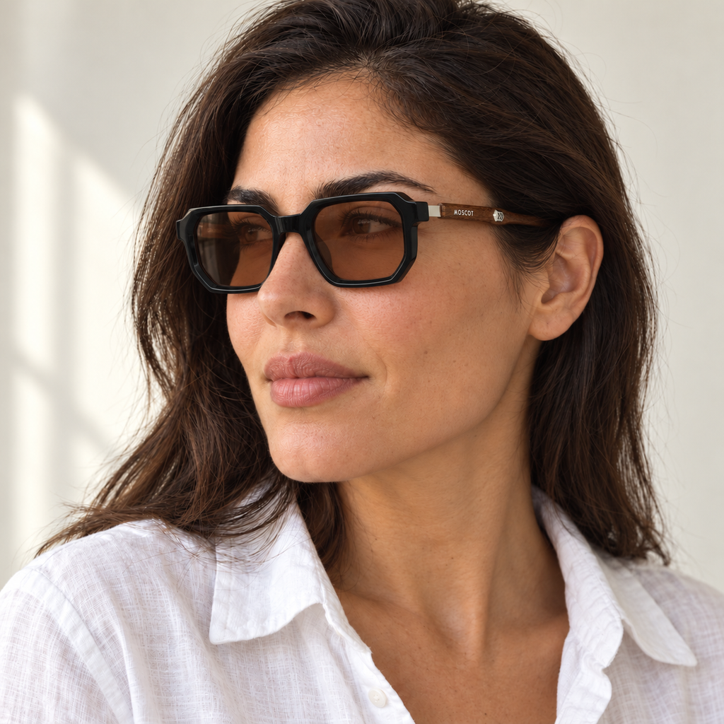 AI-generated styling image: model wearing Moscot Miltzen – Black Brown sunglasses. Fit and scale are illustrative. October 2026 refresh.