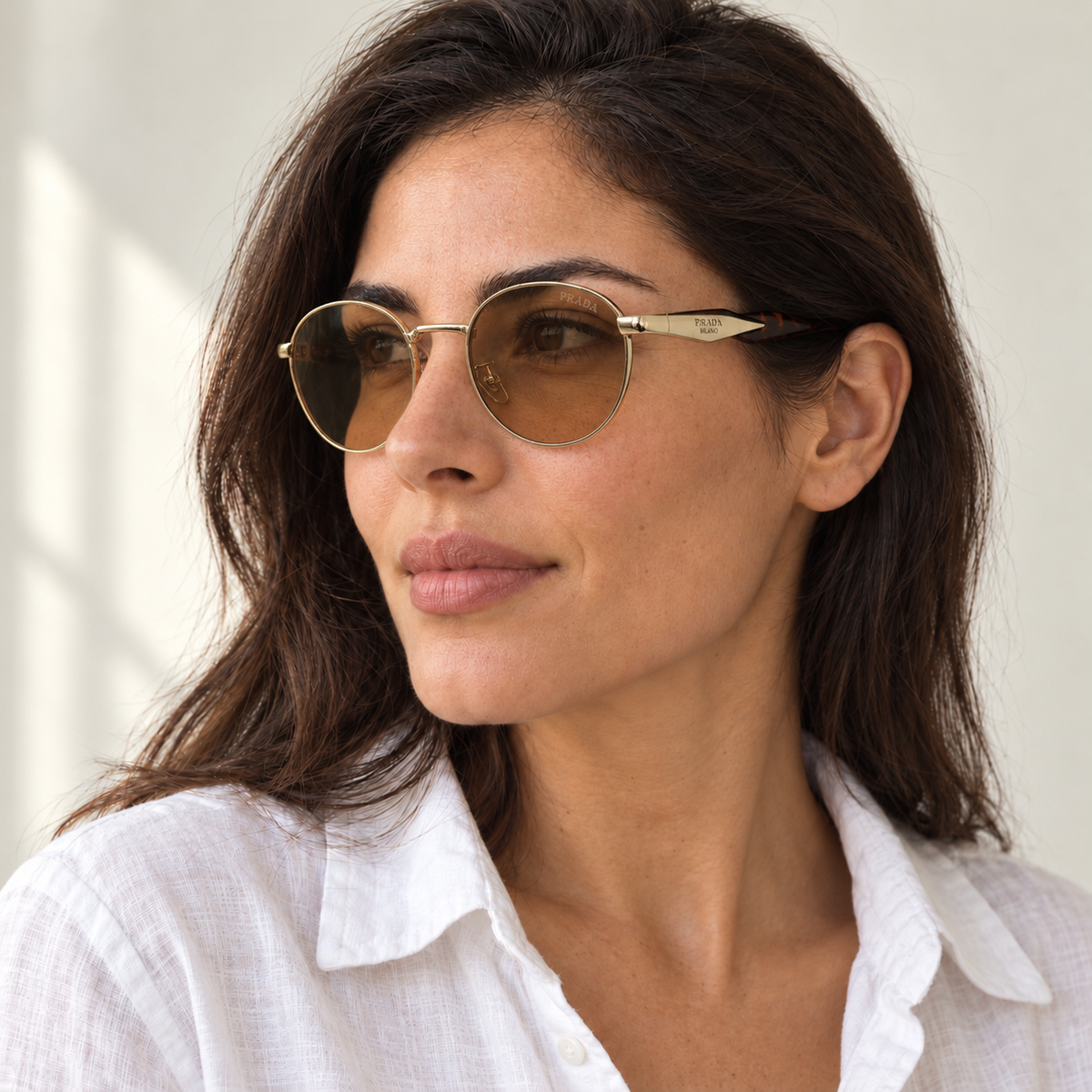 AI-generated styling image: model wearing Prada Milano Round – Black Brown sunglasses. Fit and scale are illustrative. October 2026 refresh.
